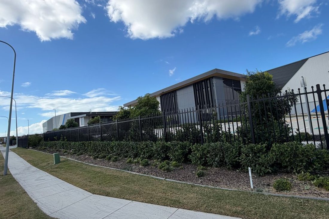 Charter Hall Industrial — fenceline with maintained lawn